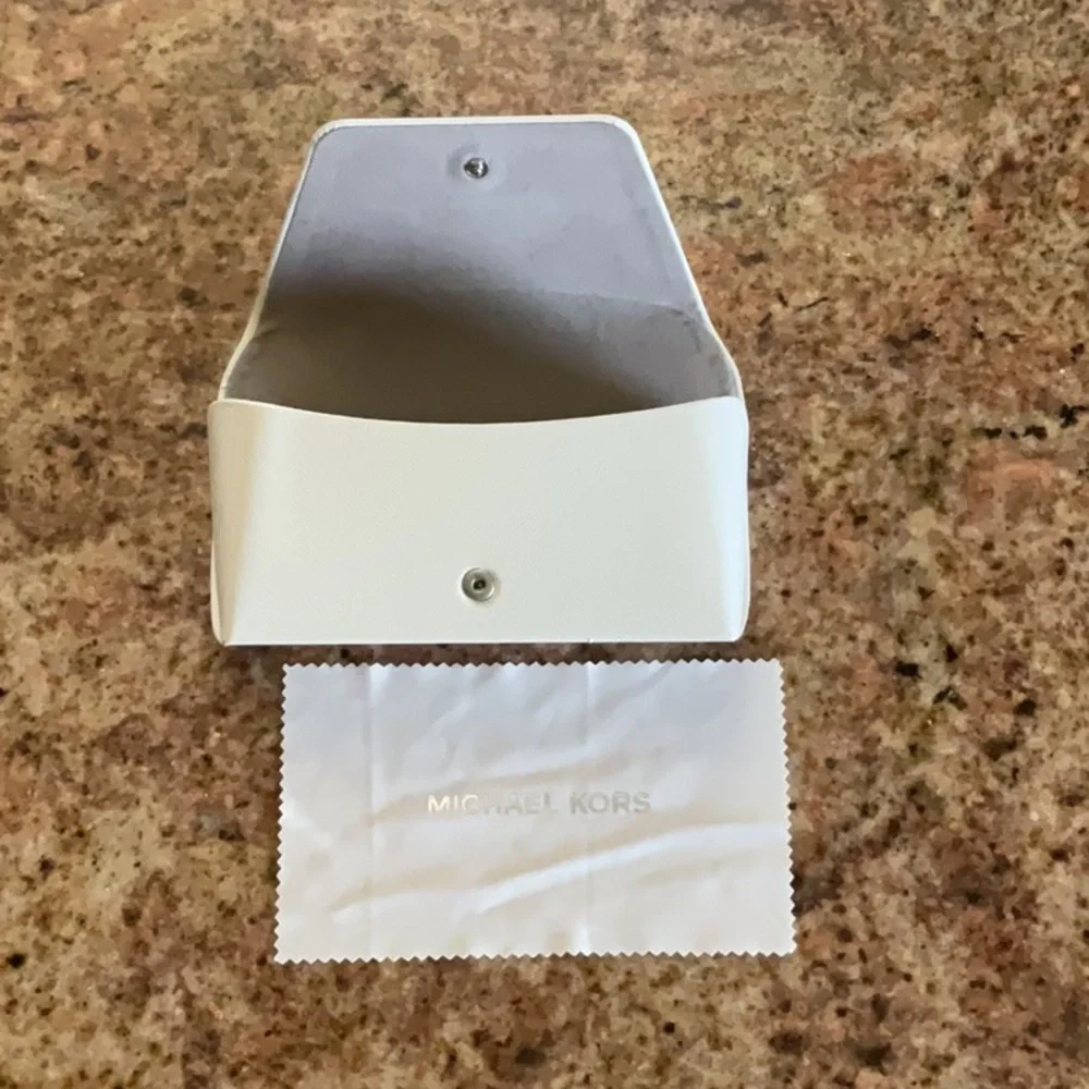 Michael Kors hard shell white eyewear case holder with cleaning cloth.
